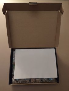 Untitled opened with folded poster on top